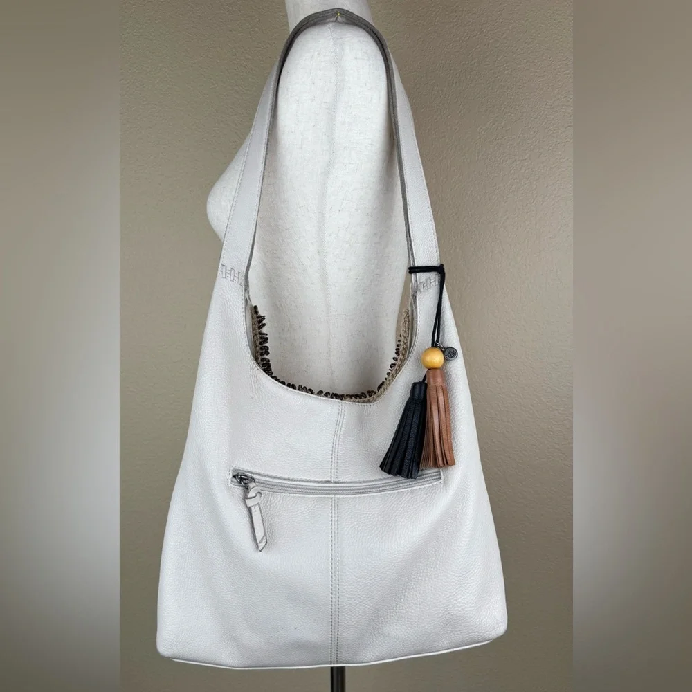The Sak Huntley Hobo Bag. Ecru.Soft, Pebbled Leather w/Fabric Turquoise Interior - Picture 2 of 16